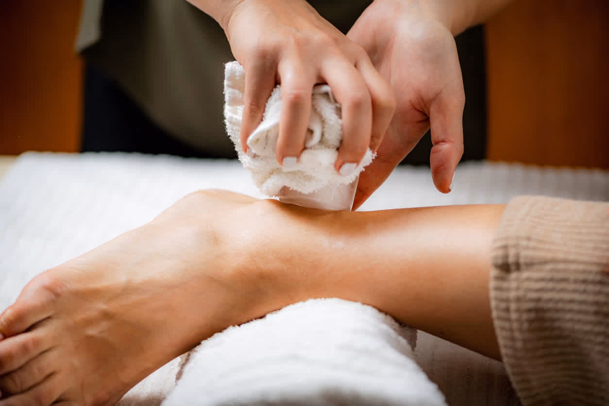 How do you use ice cups for massage?